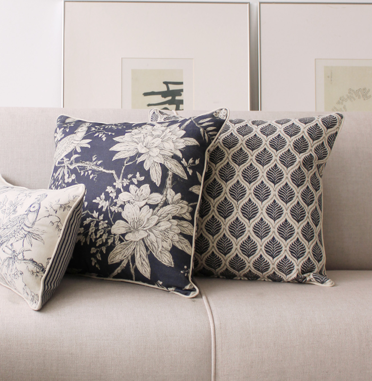 Decorative blue linen pillows with floral and geometric patterns with piping in linen vintage design