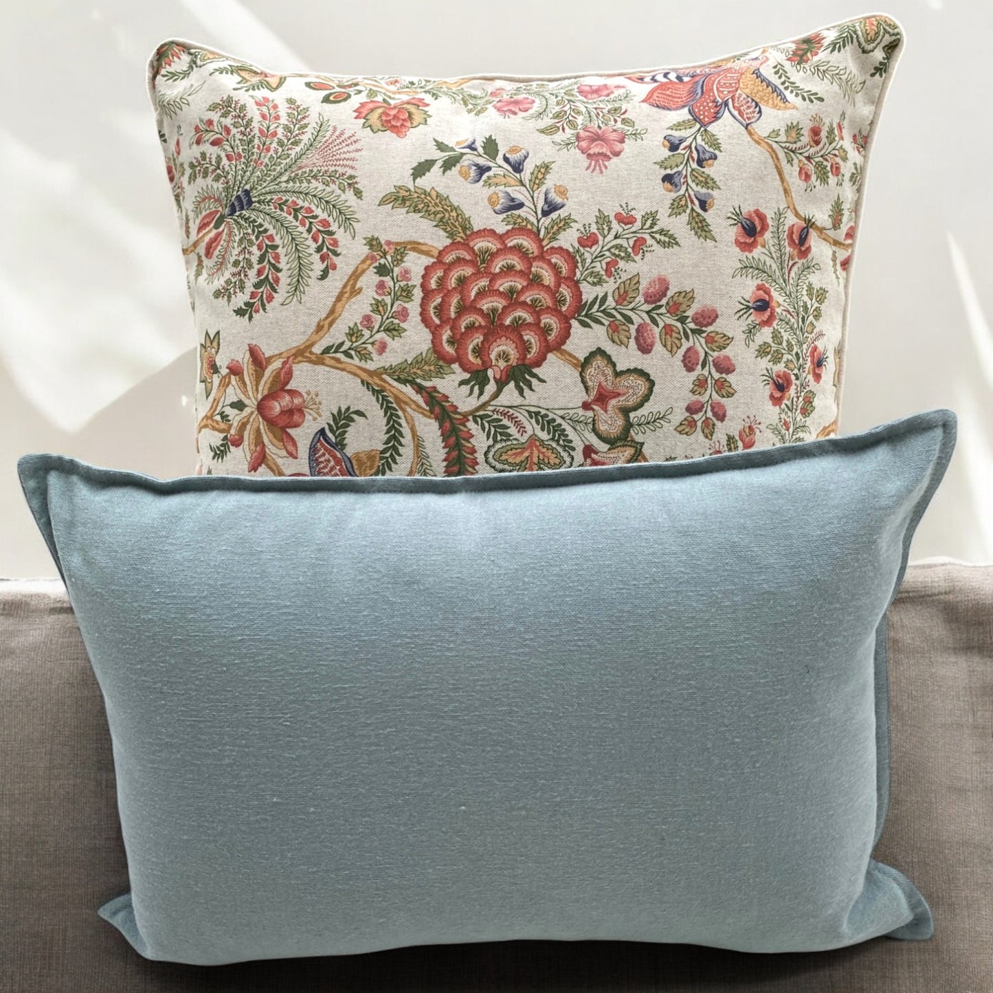 Linen & Grace Liza cushion with plain aqua cover, soft fabric, and decorative stitching on a neutral background.