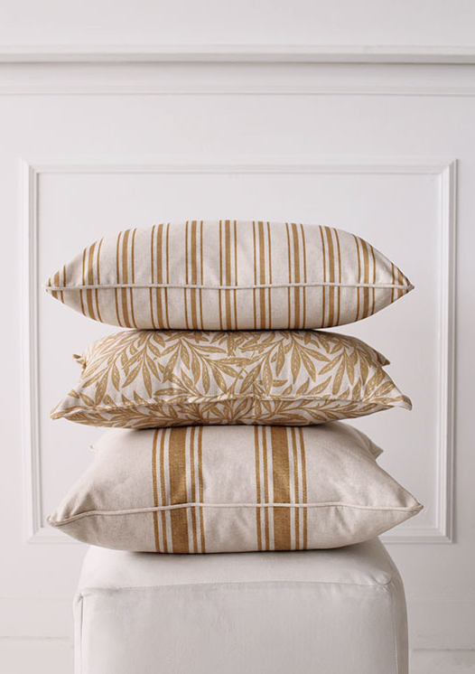 Linen & Grace Raya Ochre cushion with textured fabric and decorative piping, ideal for cozy living room decor.