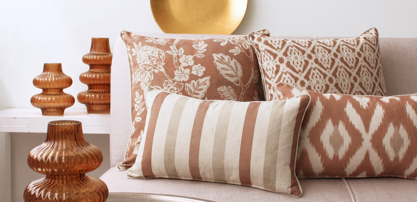 Linen & Grace Marbella Terracotta cushion with textured fabric and decorative stitching, perfect for adding warm color to your space