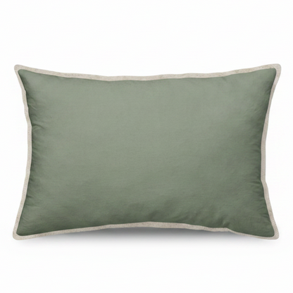 Green cushion with beige trim on a white background