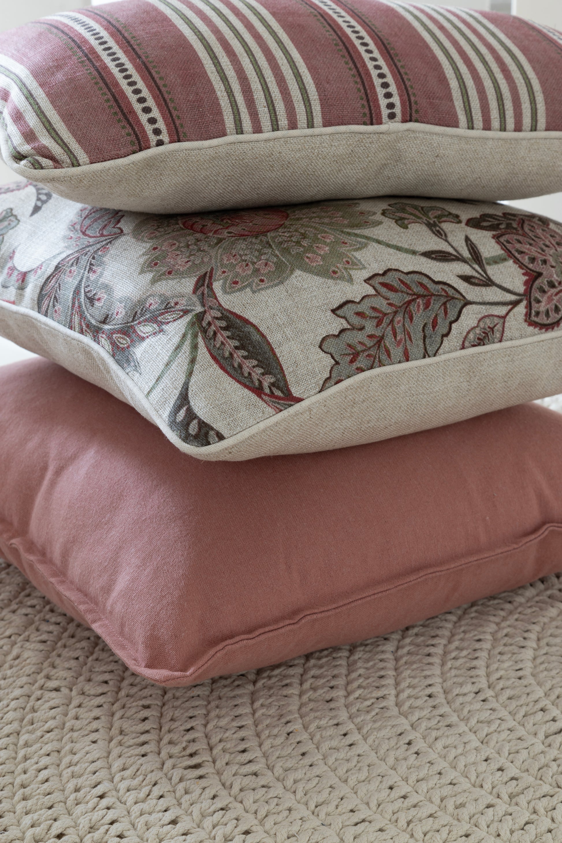 Pink striped Linen & Grace cushion measuring 30x50 inches, featuring soft fabric and stylish design.