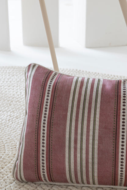 Striped pillow with a subtle pattern on a textured surface, viscolino, rustic