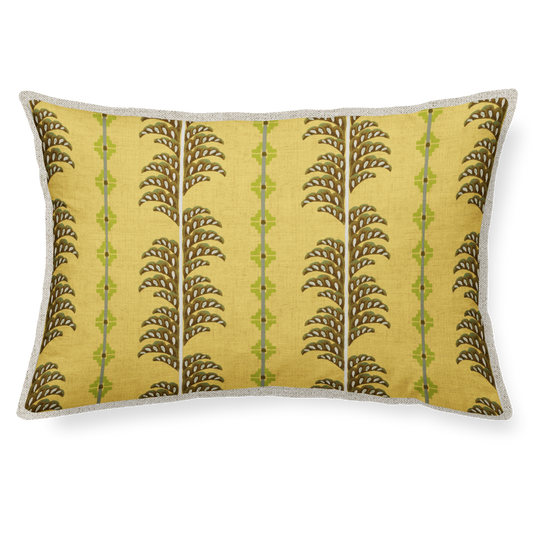 Decorative pillow with fern pattern on a yellow background