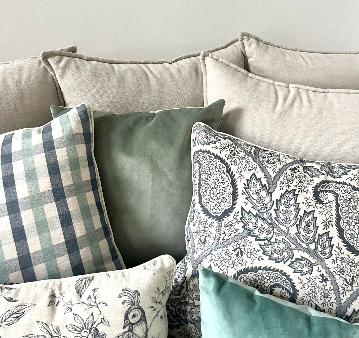 Cushions, Checked & Paisley Duo. Dual-pattern perfection: timeless checked cushions paired with an elegant paisley print for a rich, layered look