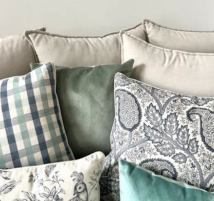 Cushions, Checked & Paisley Duo. Dual-pattern perfection: timeless checked cushions paired with an elegant paisley print for a rich, layered look
