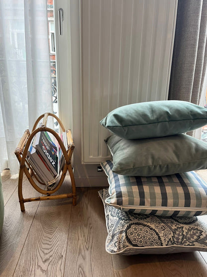 checked cushions paired with an elegant paisley print for a rich, layered look