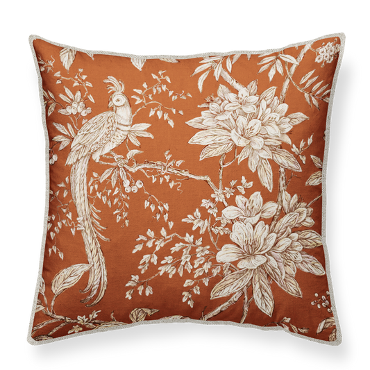 Decorative pillow with floral and bird pattern on a white background