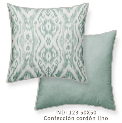 a square throw pillow with a green geometric pattern, one side with the patterned side up and the other side with a solid pale green, with a linen piping detail. 50x50cm