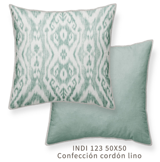 a square throw pillow with a green geometric pattern, one side with the patterned side up and the other side with a solid pale green, with a linen piping detail. 50x50cm